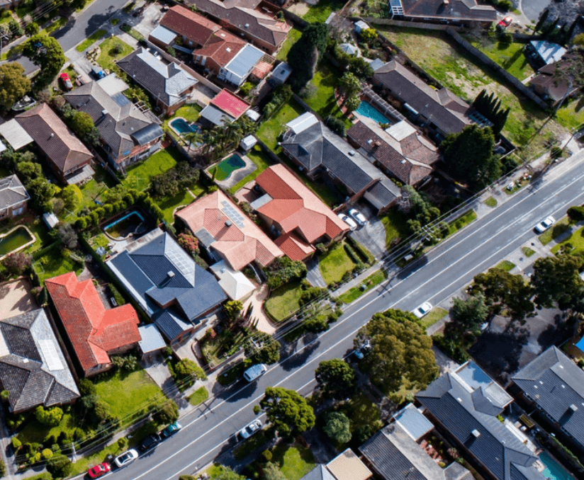 Aerial view of a suburban neighborhood with houses and streets.