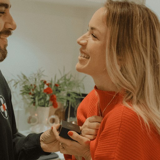 Couple holding star map jewelry and treasuring it forever