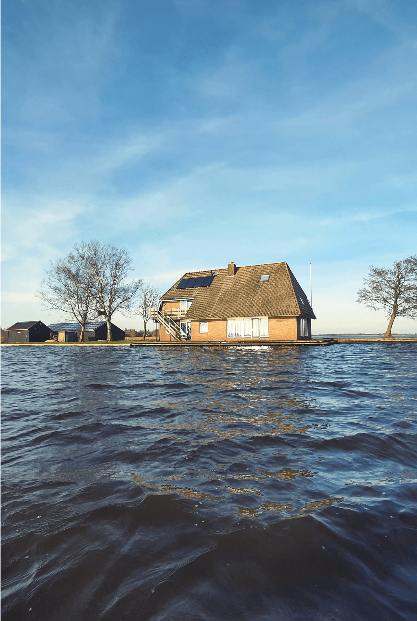 House partially submerged in floodwater, symbolising the effects of severe flooding