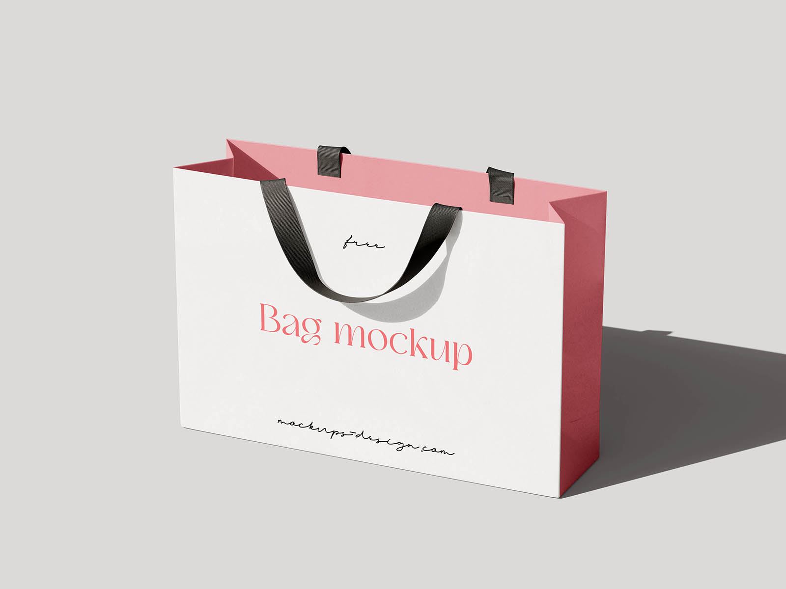 A refined mockup of a paper shopping bag with fabric handles, ideal for showcasing branding for fashion boutiques, cosmetics, or lifestyle products. The set offers four different PSD views—from front and side to angled shots—capturing the natural shadows and soft paper texture with realism. It’s a perfect choice for designers who want to present packaging designs in a polished and minimalistic setting. Easily customizable with smart objects to match any brand identity.