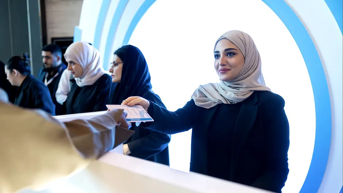 Employee giving a ticket to the event visitor