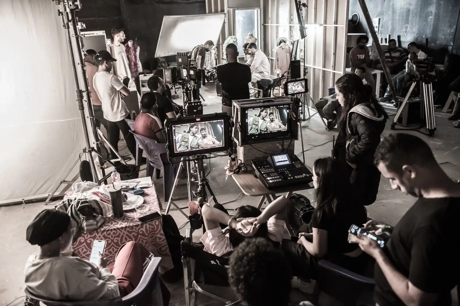Big Move production crew and camera monitors on the Pick & Match campaign set.