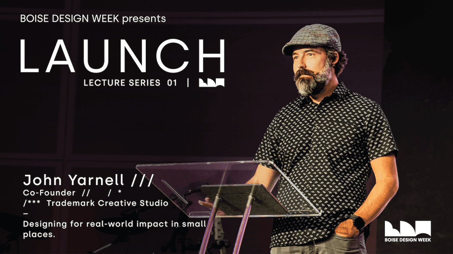 John Yarnell on stage with title LAUNCH