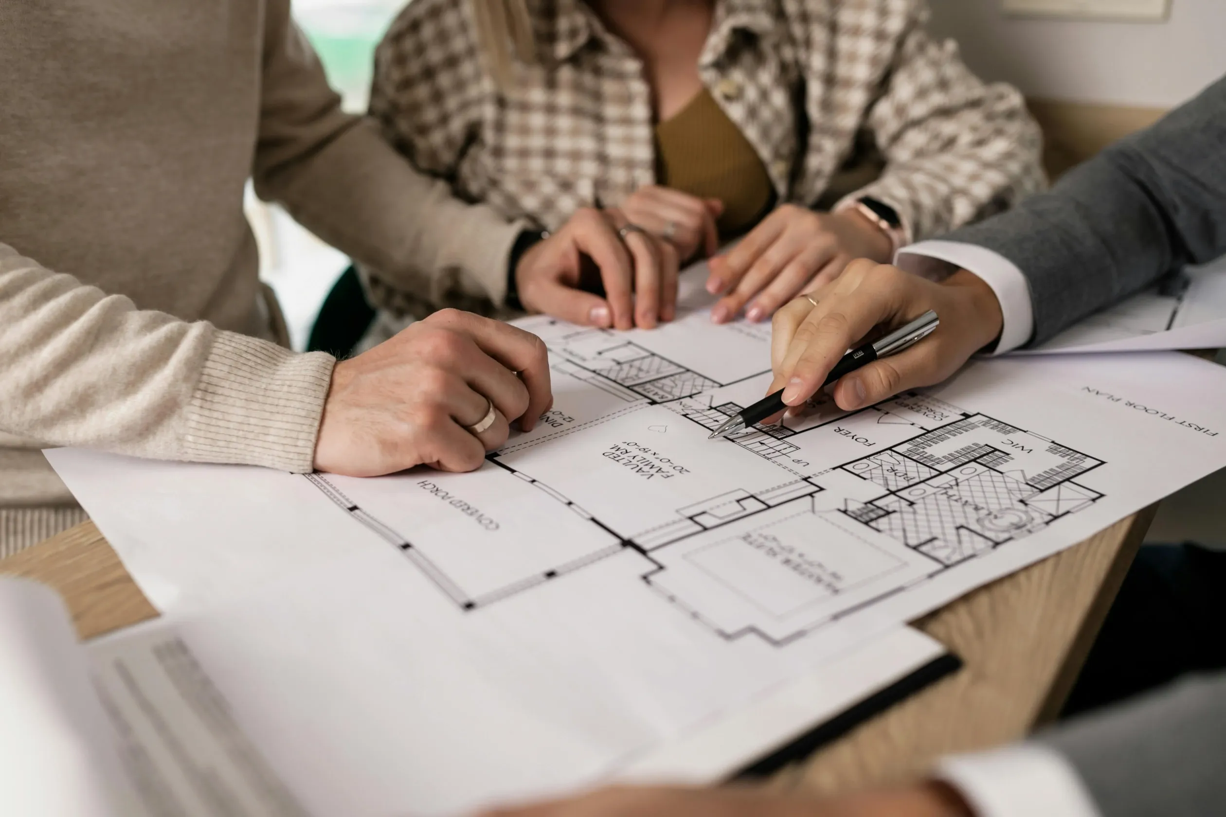 group-examining-house-floor-plans-with-a-real-estate-agent,-highlighting-home-bu - alena-darmel (pexels)