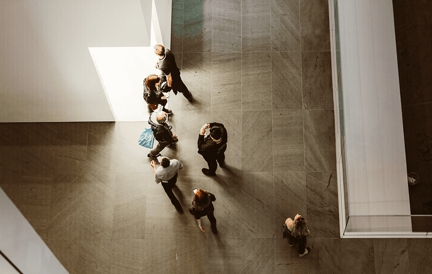 Business people in a corporate office, viewed from above