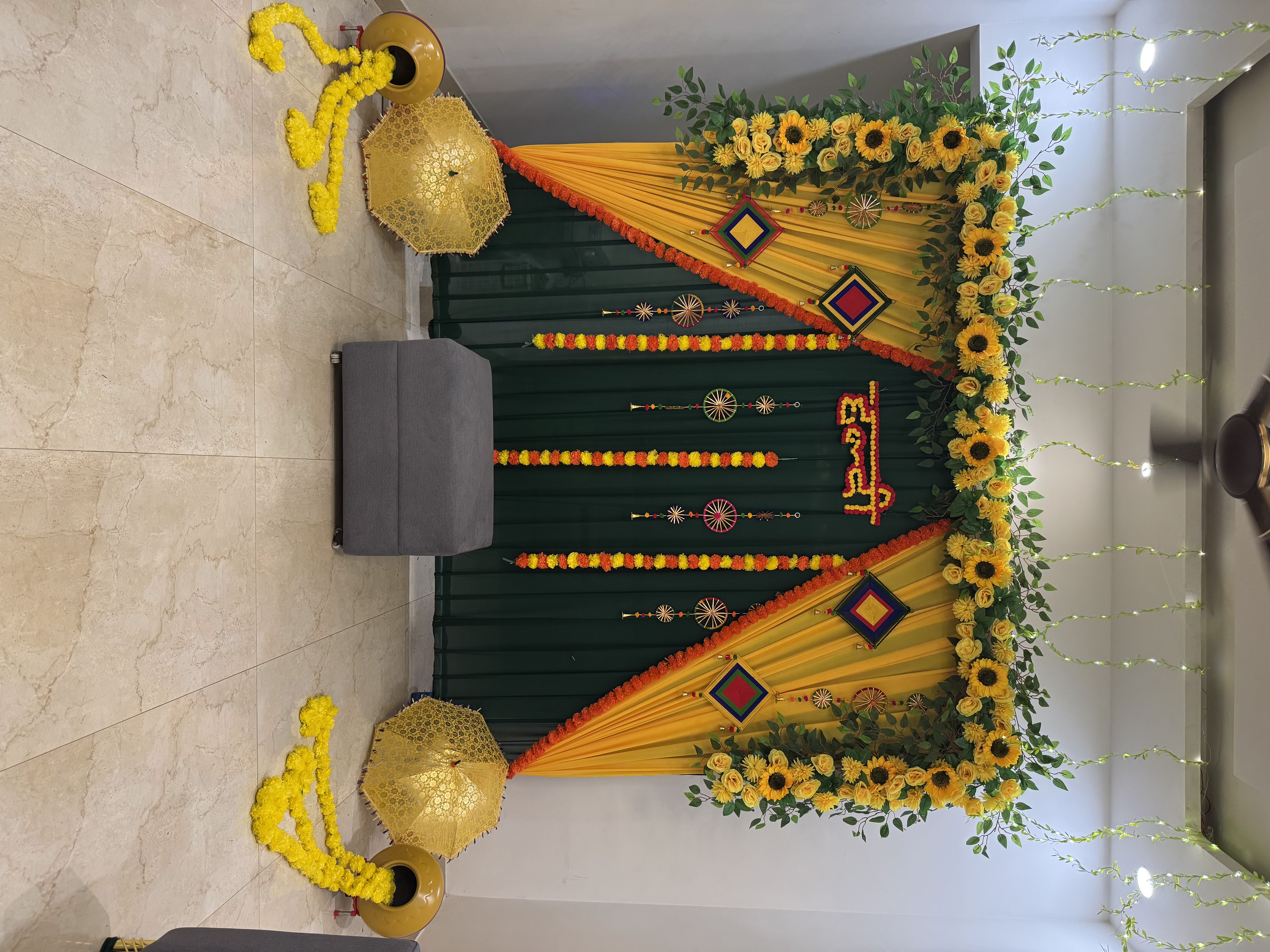 Haldi mehendi decoration at home with yellow & green chunni, sunflower flowers by Decori in Rohini, Pitampura & South Delhi