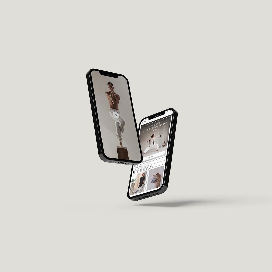 braided woman taking photo beside yellow painted wall