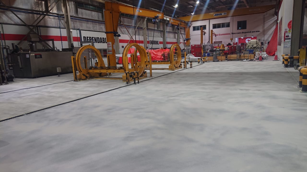 Finished industrial flooring in a heavy machinery warehouse