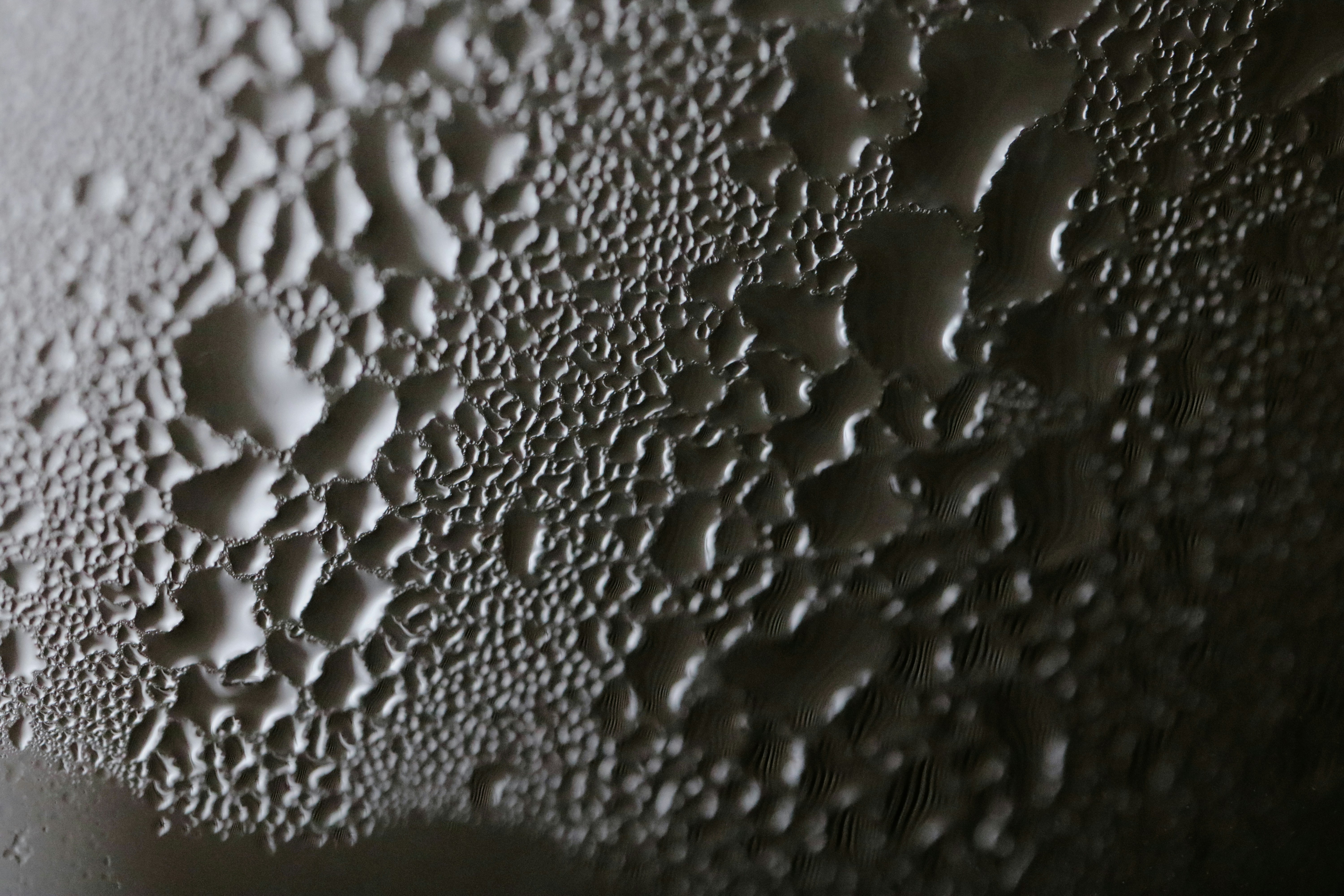 a close up of water droplets on a surface