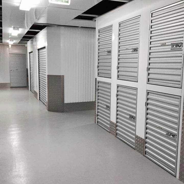 Organized business storage space in Dubai featuring clean corridors, metallic doors, and secure lockers.
