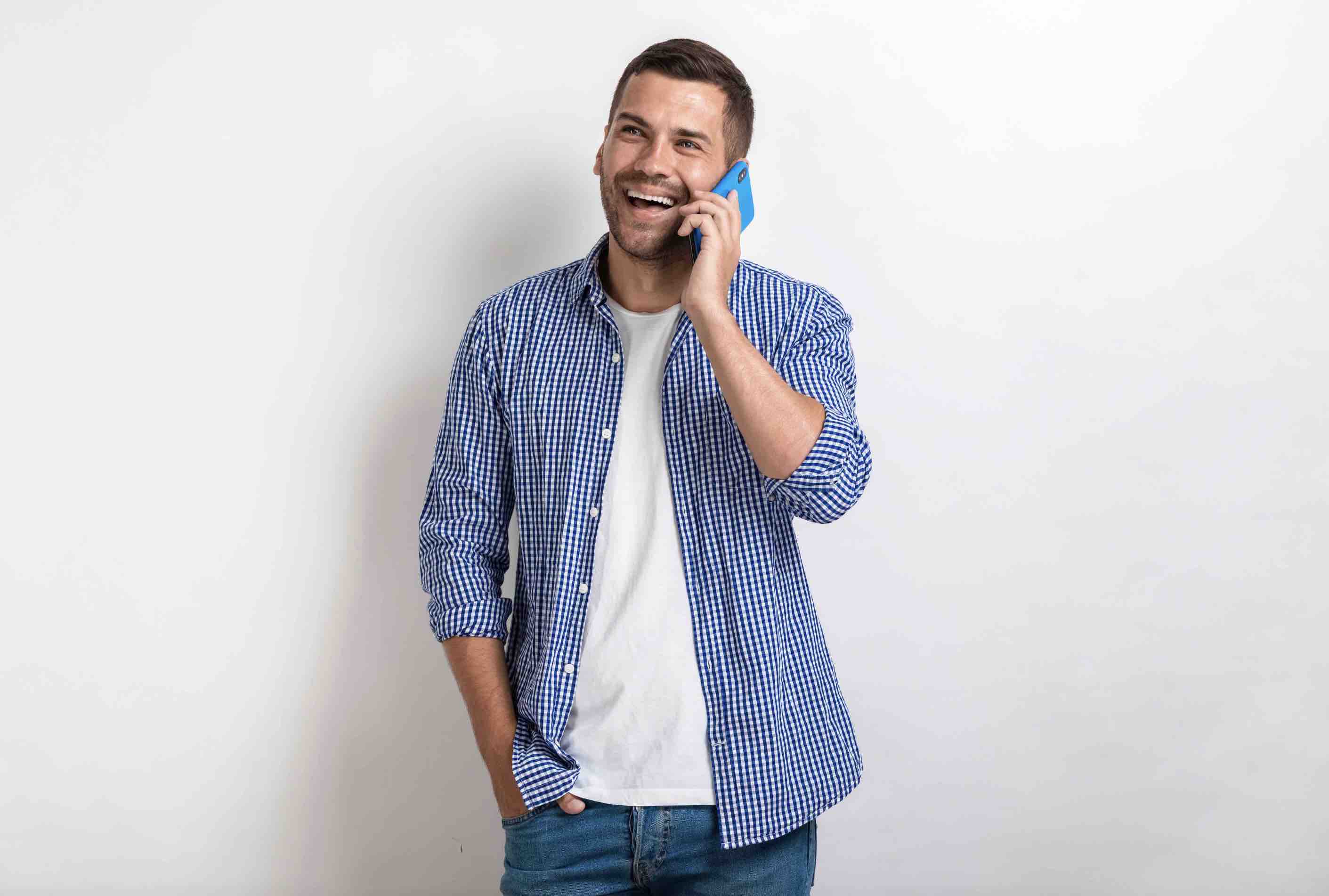 Man on the phone laughing and enjoying his conversation via his Journey Japan eSIM connection