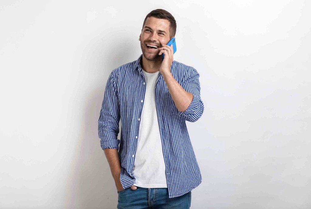 Man on the phone laughing and enjoying his conversation via his Journey Japan eSIM connection