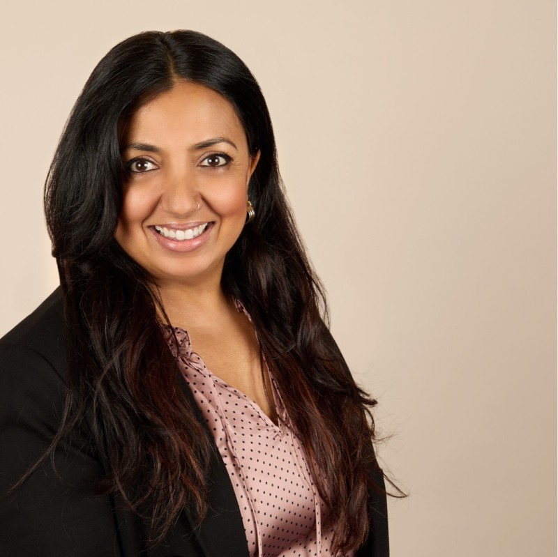 Portrait of Sachi Kittur, founder and advisor at NewHumanX, smiling in a professional setting.