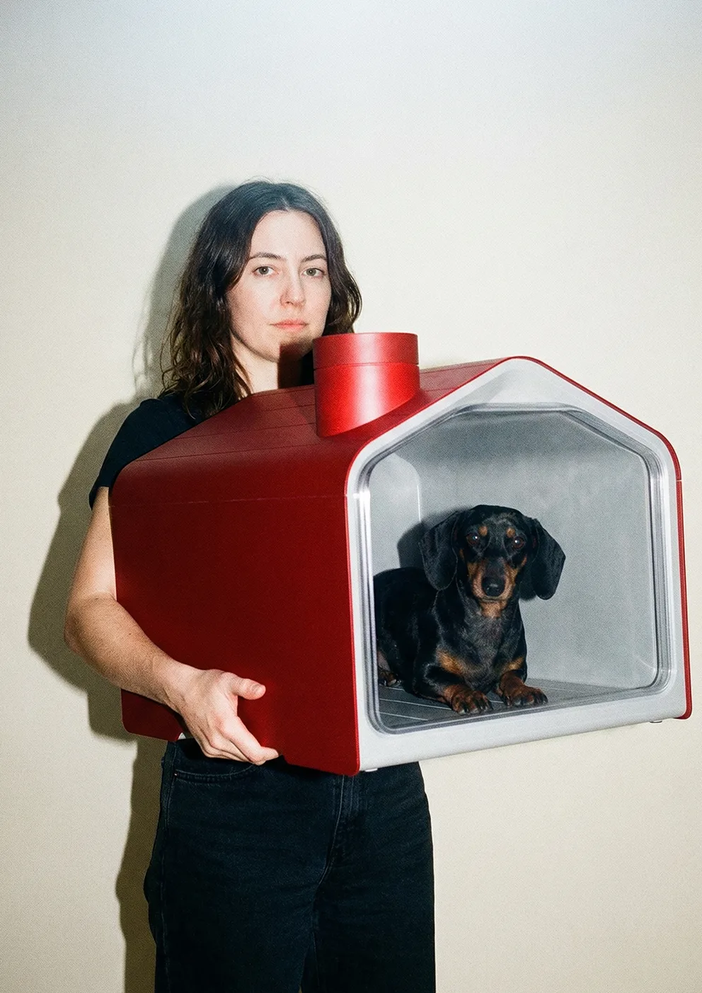Black Tesla car speeding through a desert, leaving a dust trail, showcasing speed and adventure in a vast, open landscape.