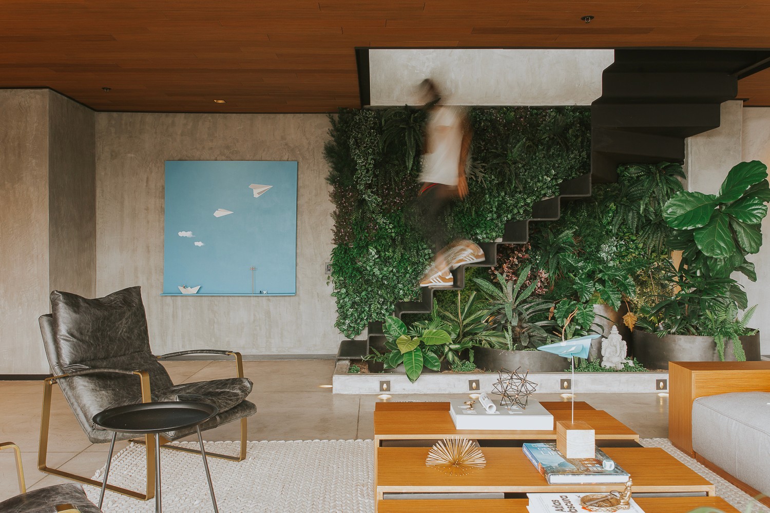 Double-height interior with flowing sculptural forms and warm raking light