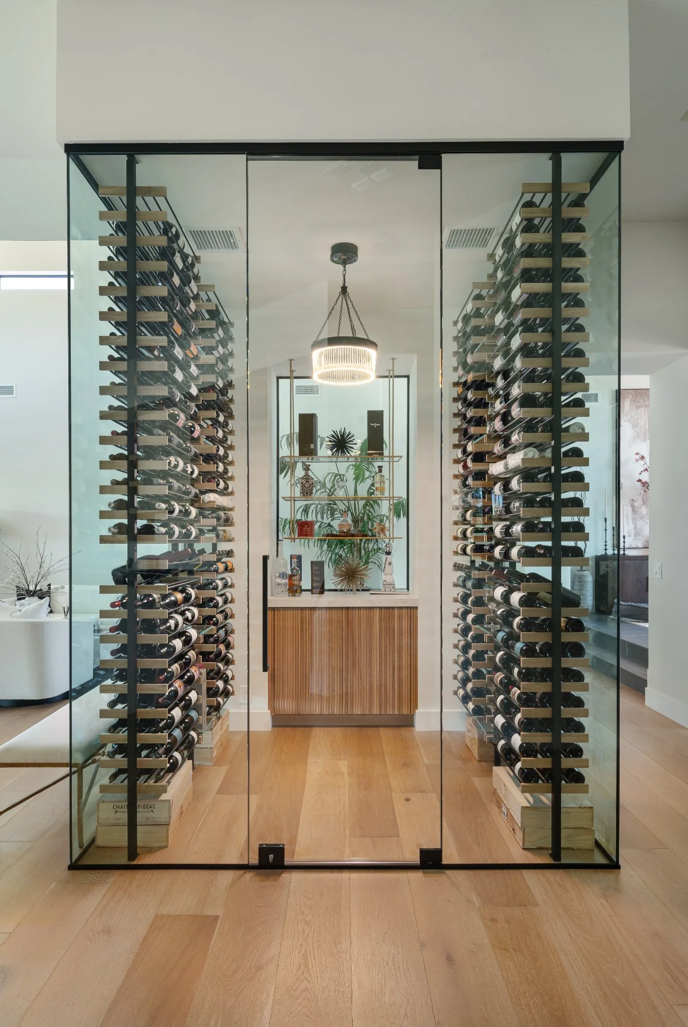 nfinity pool blending into the ocean view, minimalist sun loungers in soft neutral fabric, curved architecture