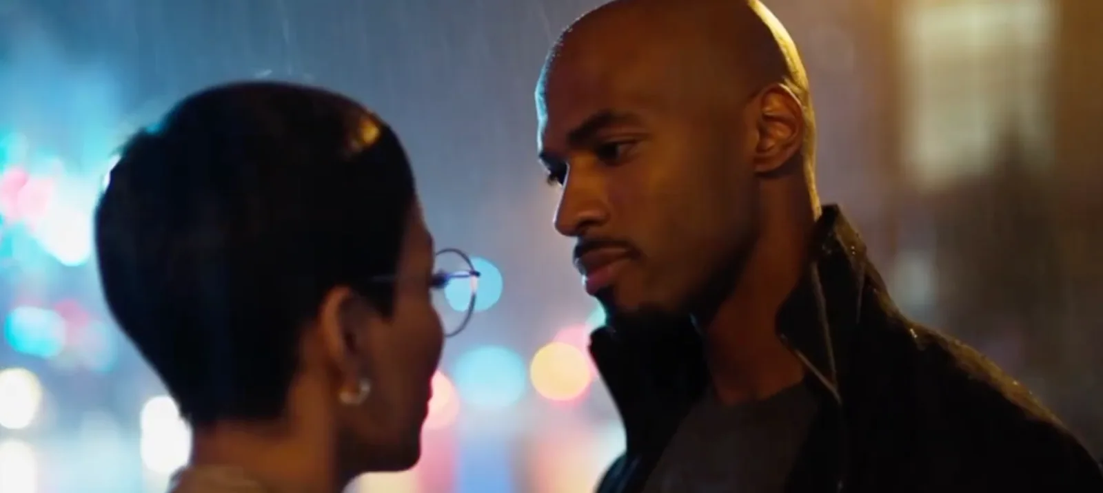 Two characters in a dramatic scene from The Whole 9