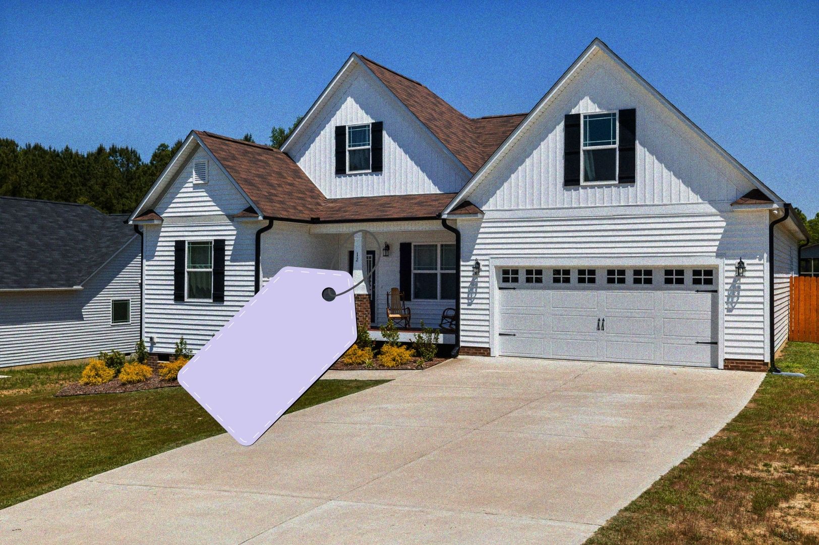 White suburban home with price tag graphic