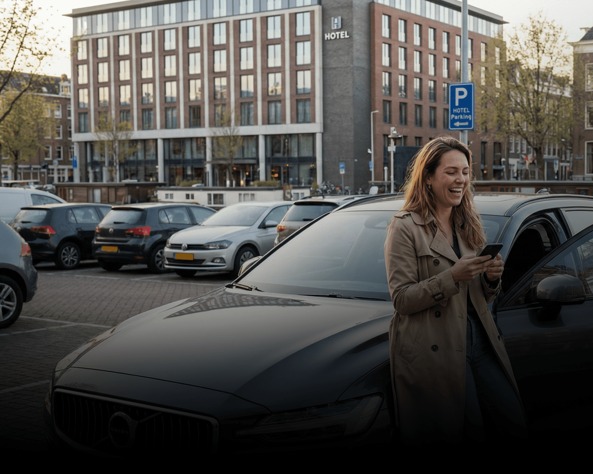 two people looking at a tablet and smiling