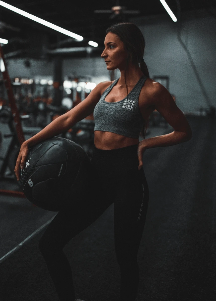 woman standing and holding ball