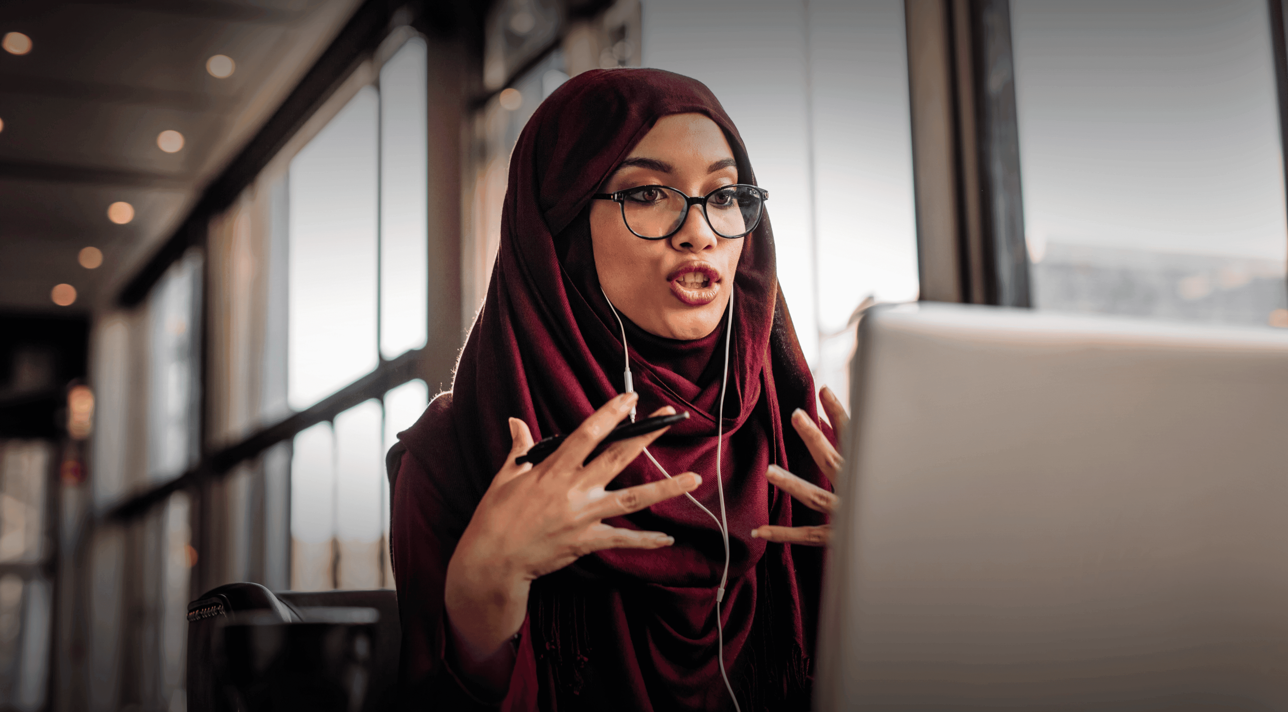 A young muslim woman taking a call to discuss a Commerical Property Vacancy in Farnborough