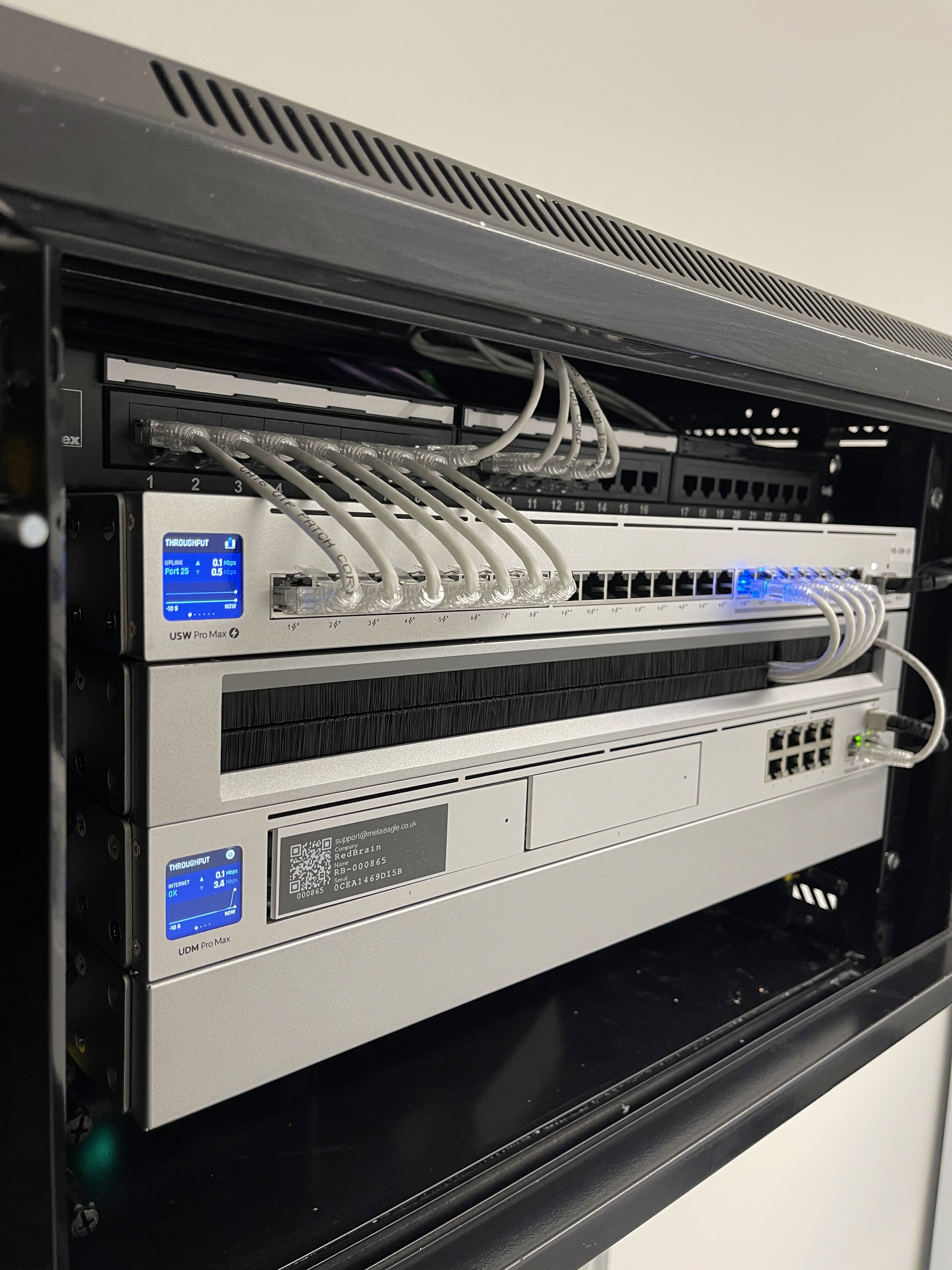 Laptop on a clean desk next to modern decor.
