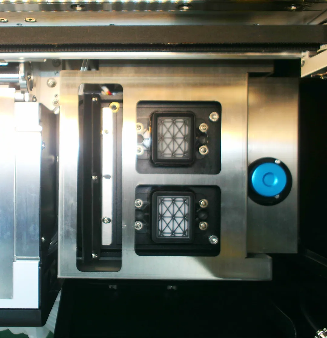 Automated maintenance cleaning view 1 of the Gravity Pro DTF printer, capturing the top-down perspective of the nozzle cleaning station.