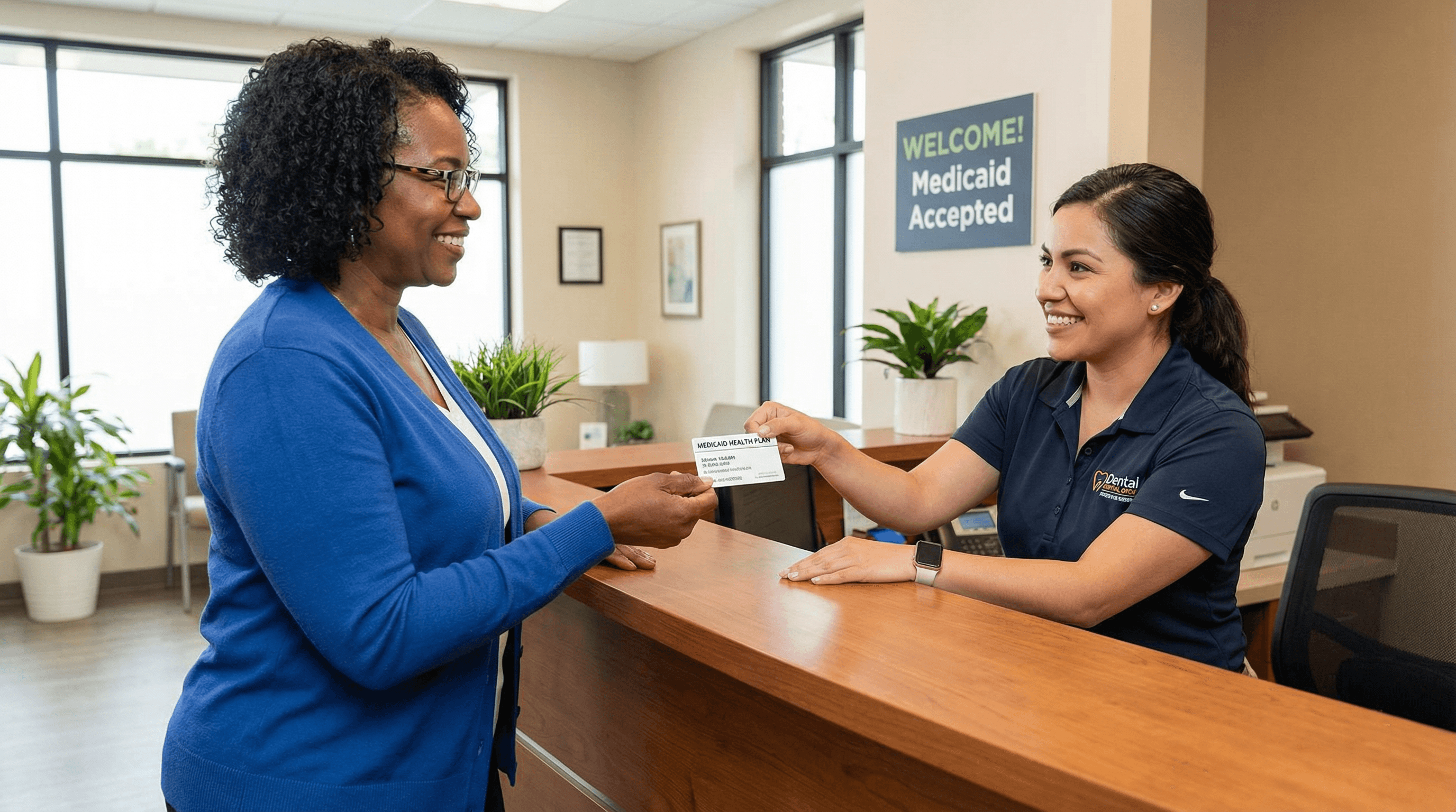 Patient presenting Medicaid card at dental office reception during check-in, showing accessible and welcoming Medicaid dental care at Veda Family Dentistry.