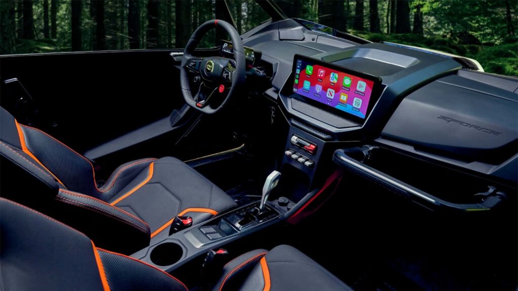 Interior of a car featuring sleek, modern seats, illuminated in a dark setting, emphasizing design and luxury.