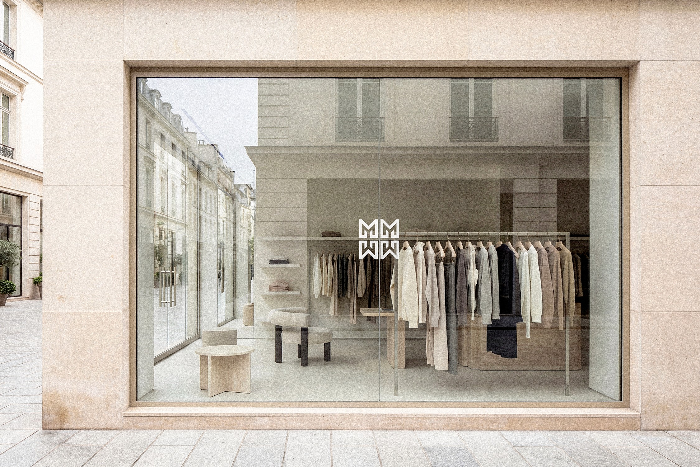 MAË PARIS minimalist luxury fashion boutique storefront in Paris with modern architecture and neutral tones