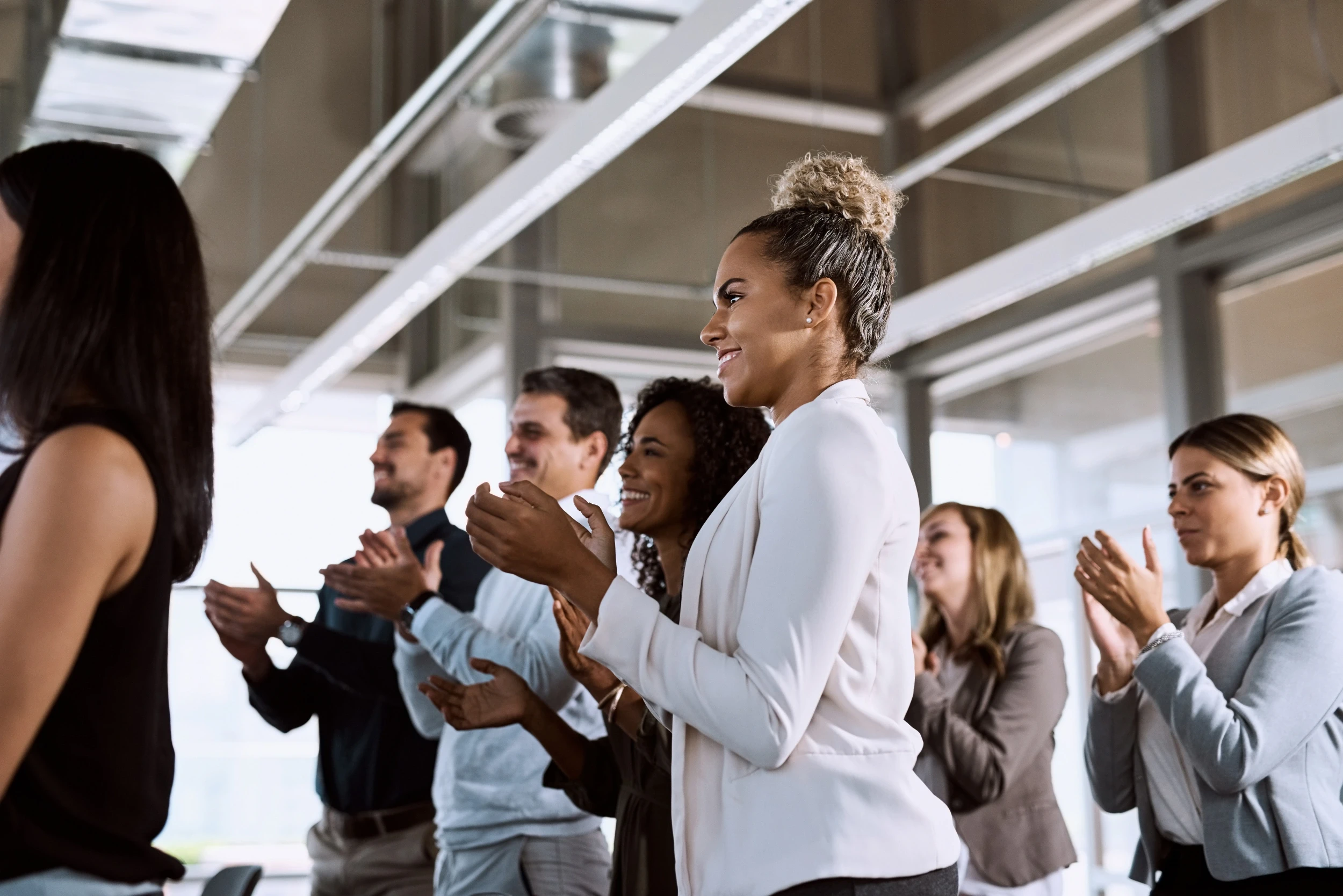 adults standing and applauding