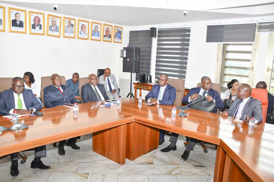boy in blue crew neck t-shirt standing on red and white textile