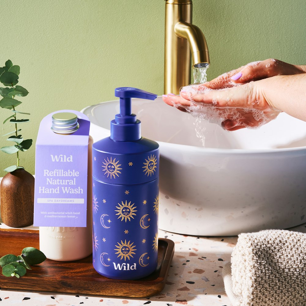 A bespoke Wild Cosmetics hand wash refill bottle manufactured from VIVOMER. This custom packaging project demonstrates VIVOMER's high-performance liquid barrier properties for surfactants, providing a 100% plastic-free, retail-ready solution for the personal care industry.