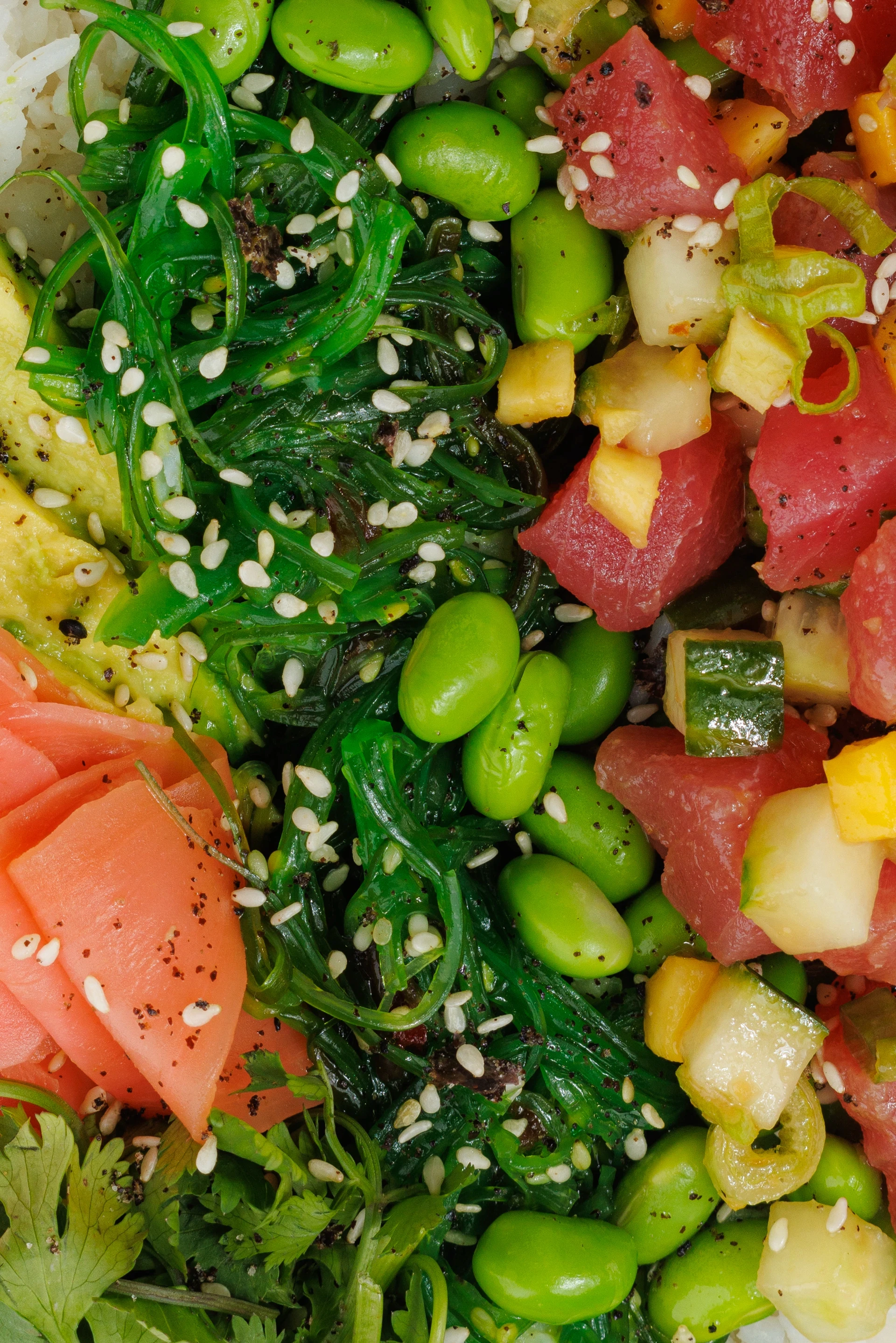 Close up view of two salad bowl ingredients.