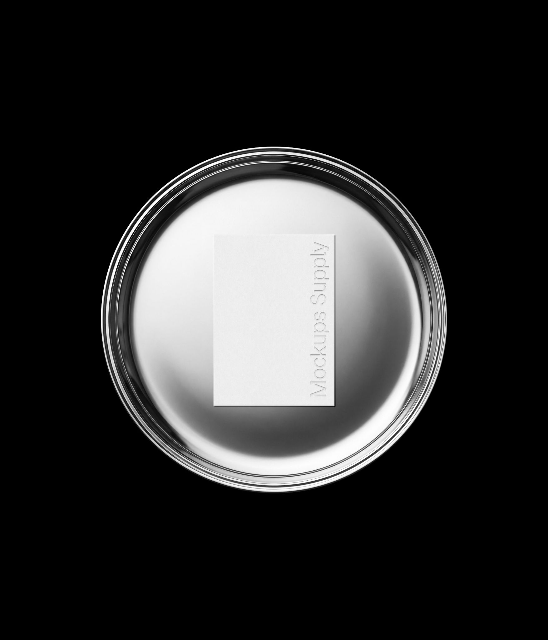 Business card mockup on round metal plate with debossed text effect for branding and stationery presentation