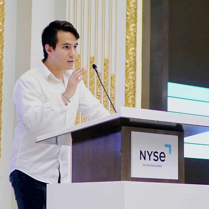 man standing beside wall