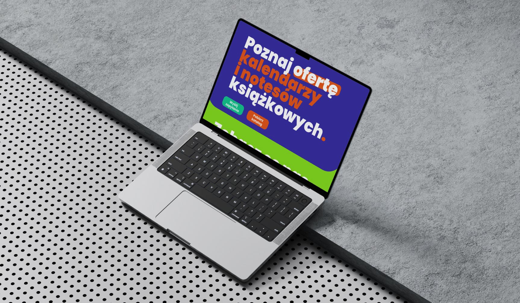 Laptop prezentujacy oferte personalizowanych kalendarzy ksiazkowych i terminarzy.