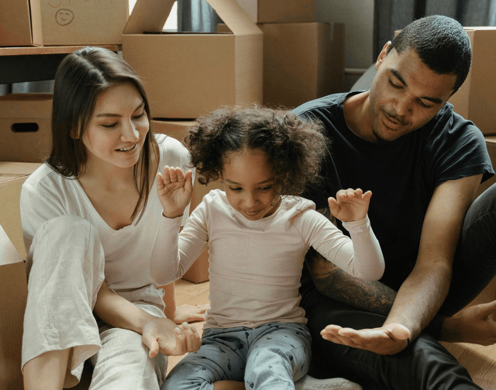 Happy family of three in a property and they just moved in