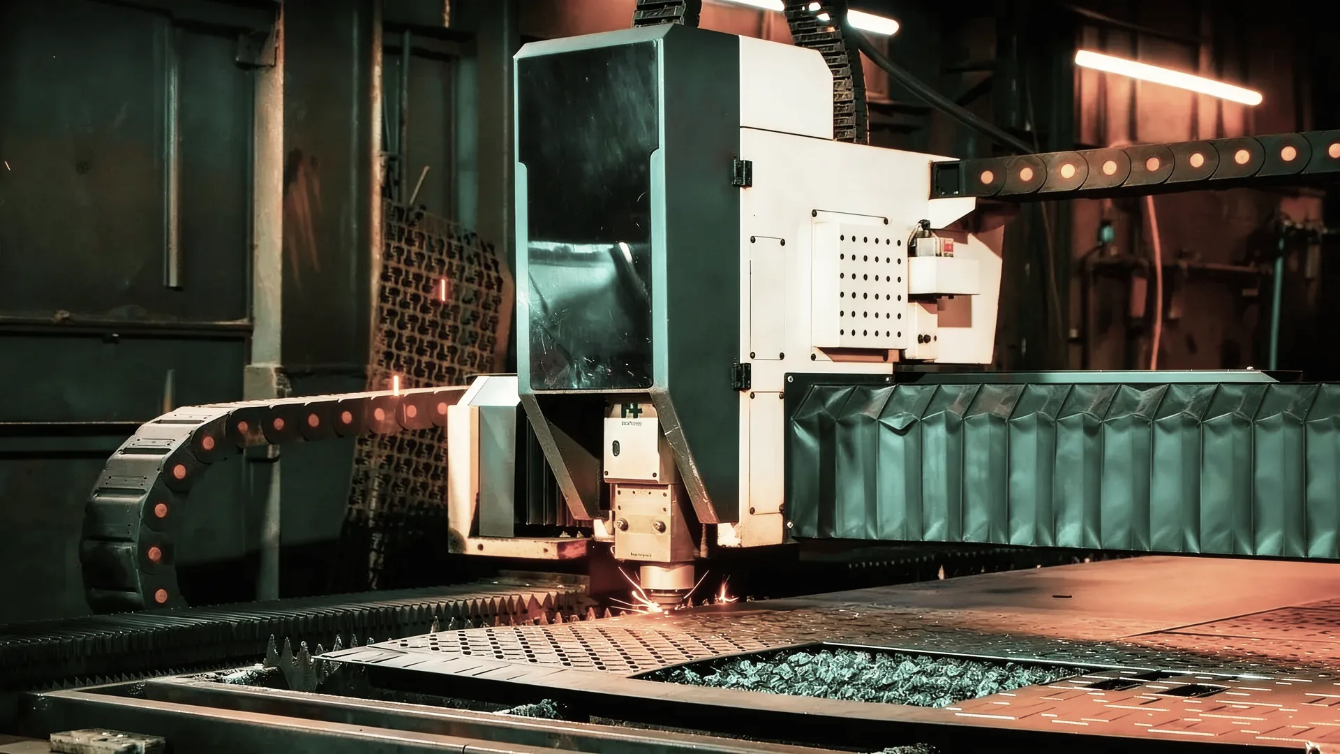 Industrial laser cutter working on metal sheet