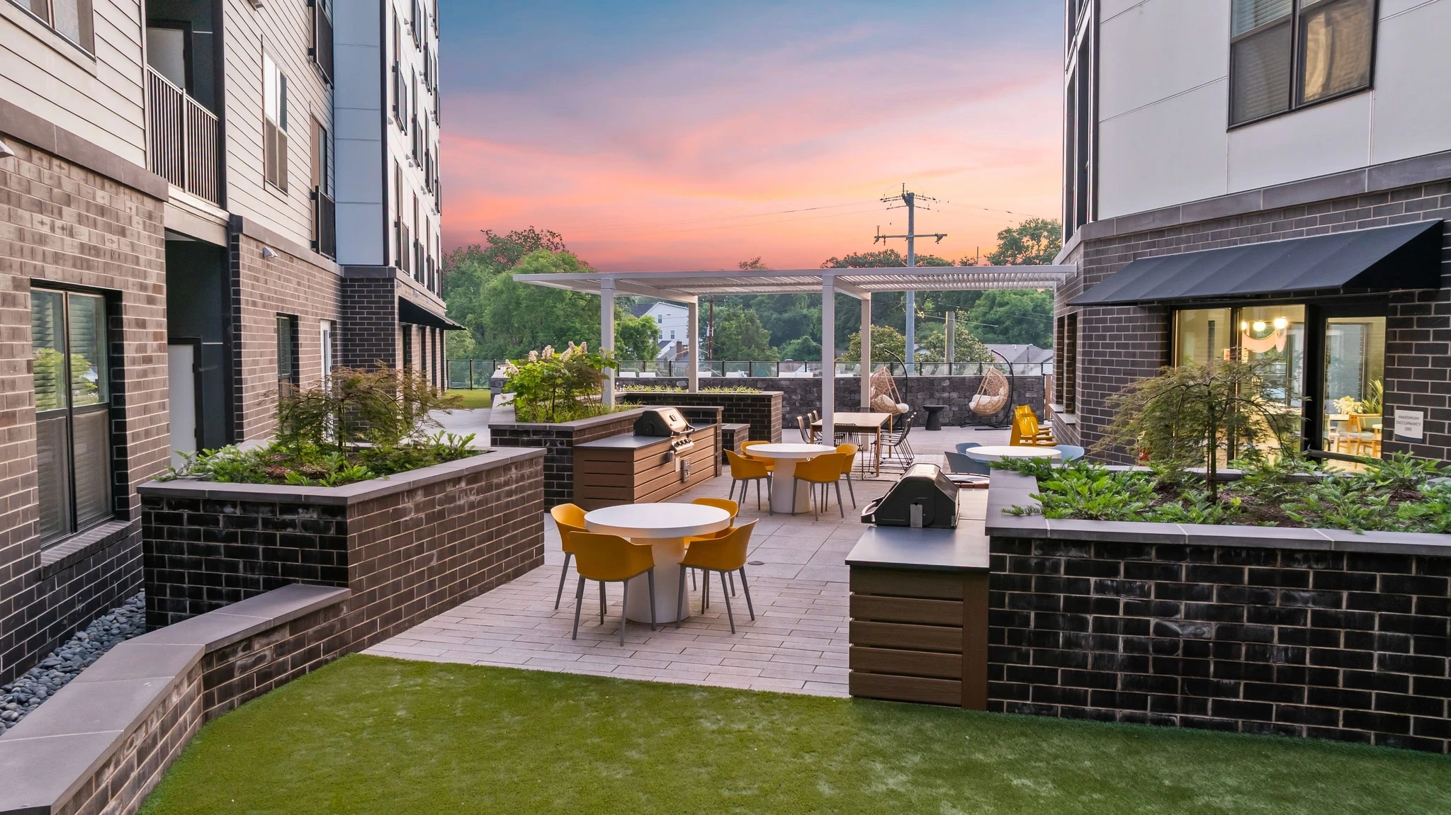 A stunning view of prime real estate showcasing modern homes and lush landscaping in a vibrant neighborhood.