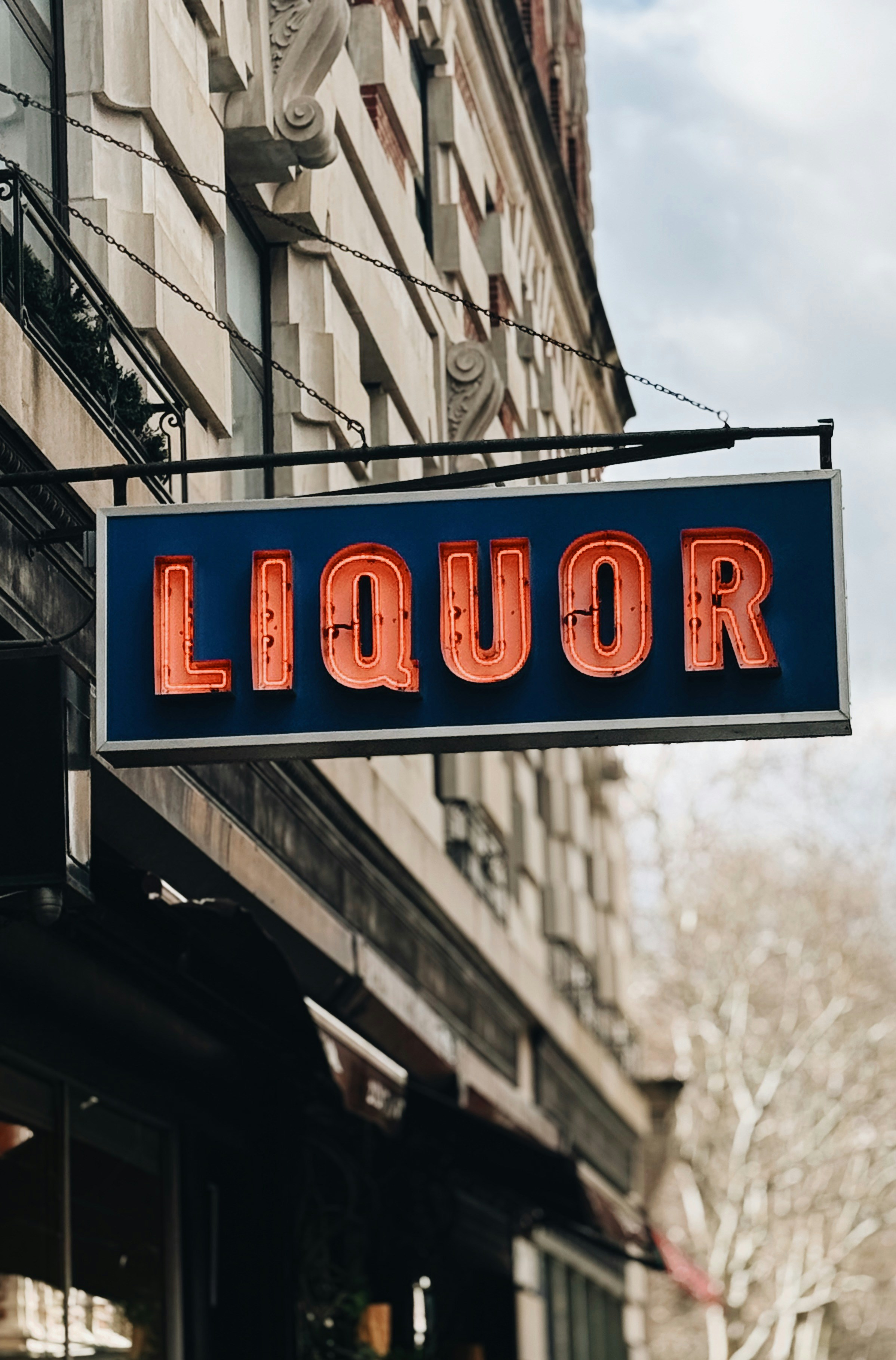 Liquor store sign with neon lights.