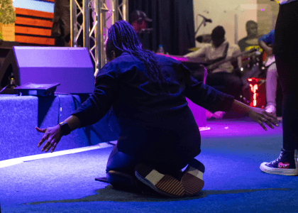 Woman on her knees praying