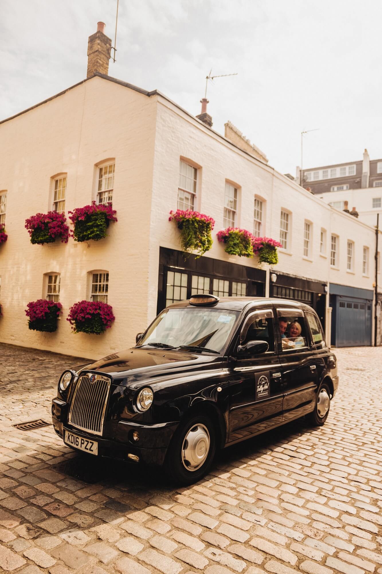 A London black cab exploring cobbled streets