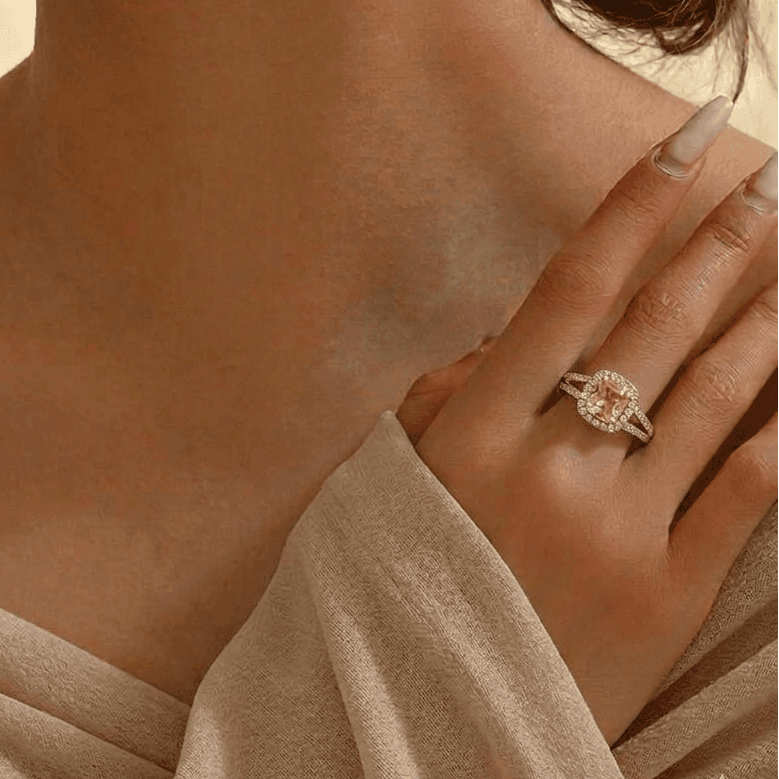 Woman's hand wearing the Rosalind Cluster Ring in rose gold