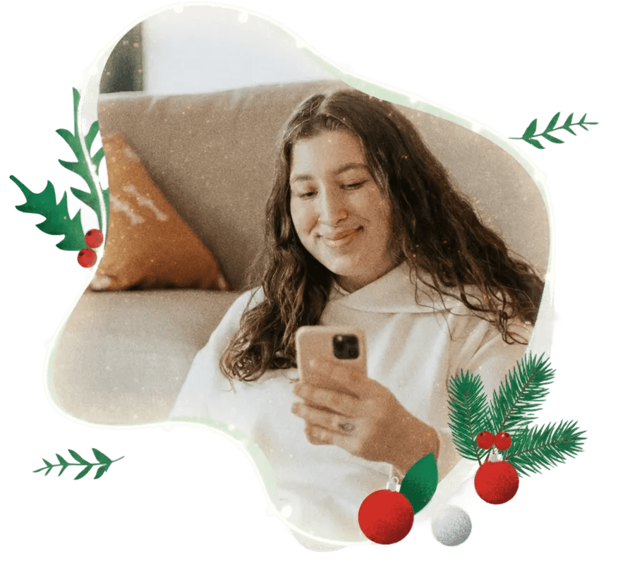 Woman smiling at her phone learning her nutrition therapy is covered by insurance