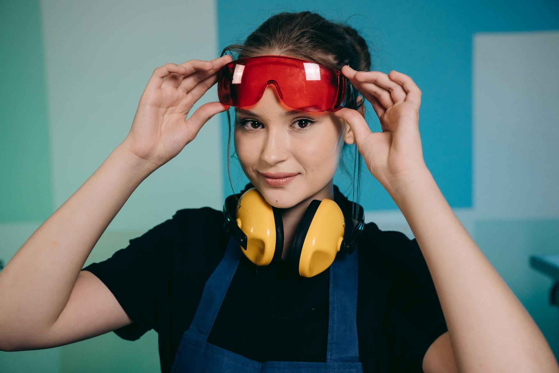 Smiling woman with red goggles