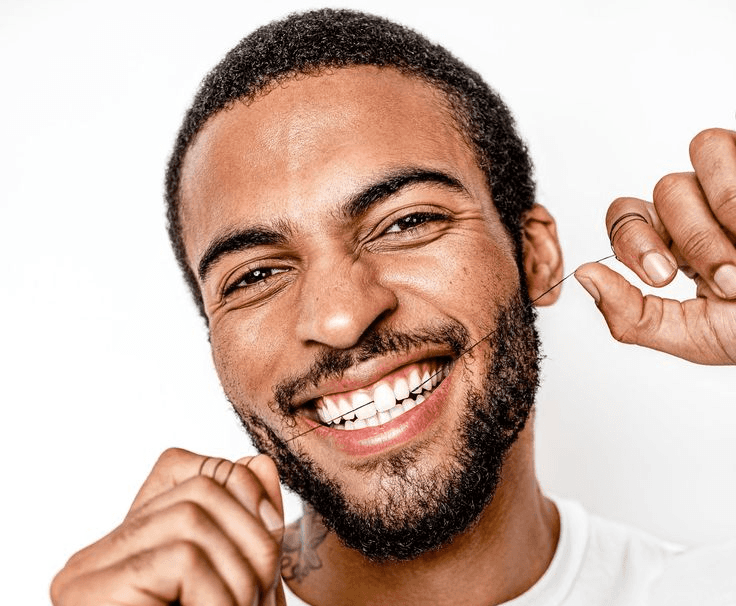 Beautiful lady with a ray of sunlight shining on her face