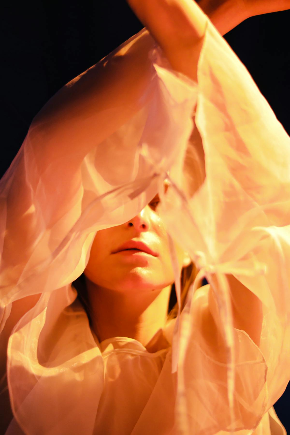 Artistic portrait of a woman in a white dress