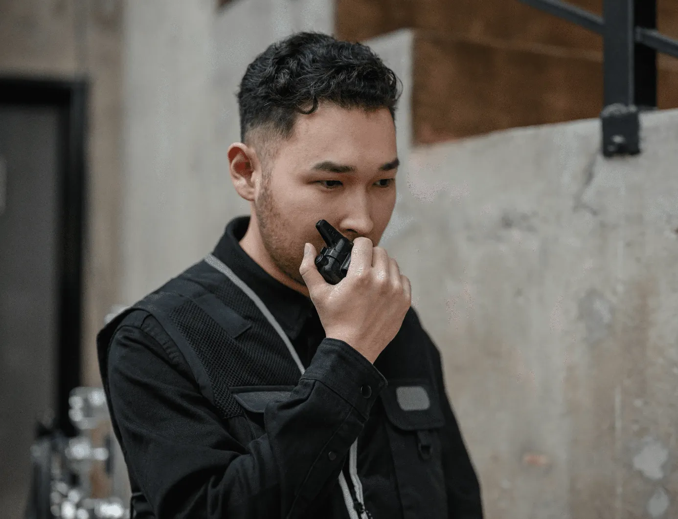 asian-security-guard-using-walkie-talkie-in-an-indoor-setting,-demonstrating-com - ron-lach (pexels)