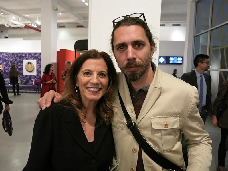 portrait of a woman dressed in black and a man dressed in beige